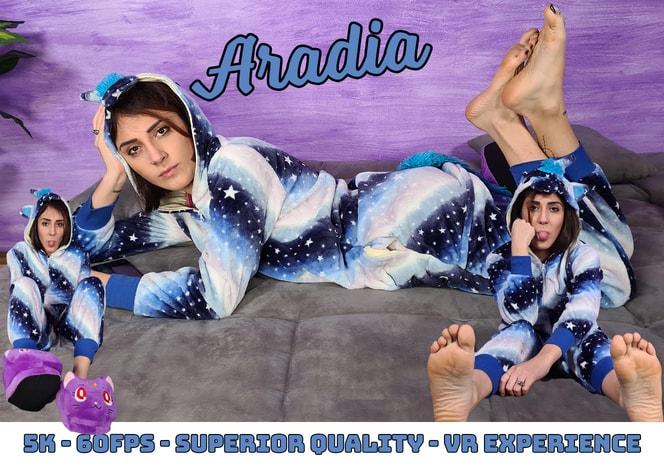 Stunning Aradia in a one-piece hooded pajama and purple slippers 2560p
